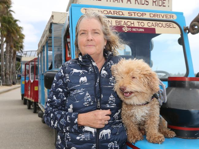 Long term little train driver Maree Williams has been forced to quit after 11 years due to illness. Sh eis pictured at the Geelong Waterfront with her dog Bailey. Picture: Peter Ristevski