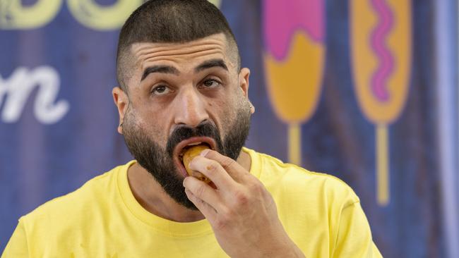 James Webb, winner of the Ekka 2022 Dagwood Dog Eating Competition. Picture: Richard Walker