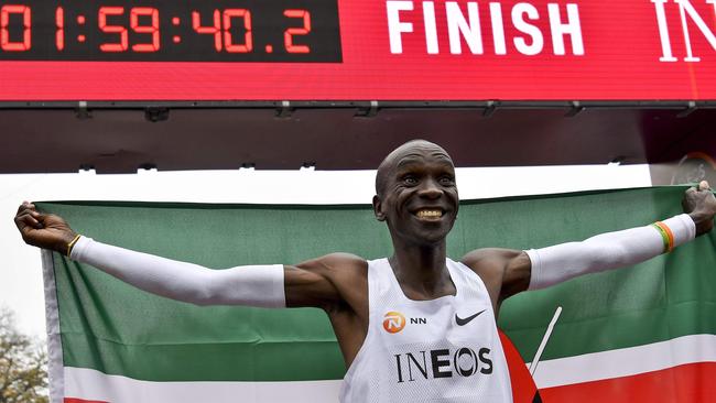 Kenya's Eliud Kipchoge celebrates after busting the two-hour marathon barrier. Picture: AFP