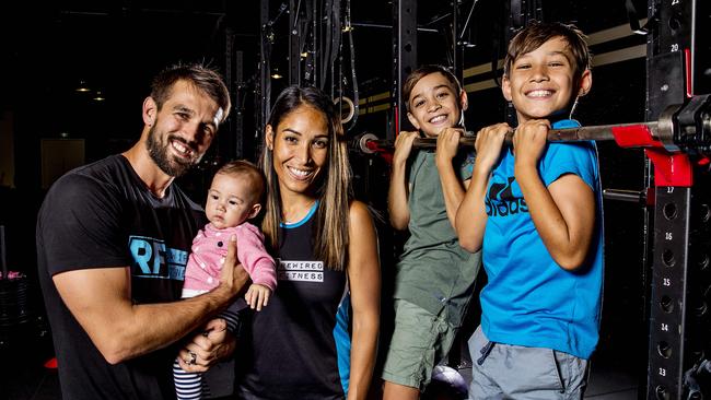 Rewired Fitness won the Best of the Gold Coast competition last year. Owners Alex and Sofia Houldsworth with their children Ayla, Benjamin, 9 (blue shirt), and William, 10 (green shirt). Picture: Jerad Williams