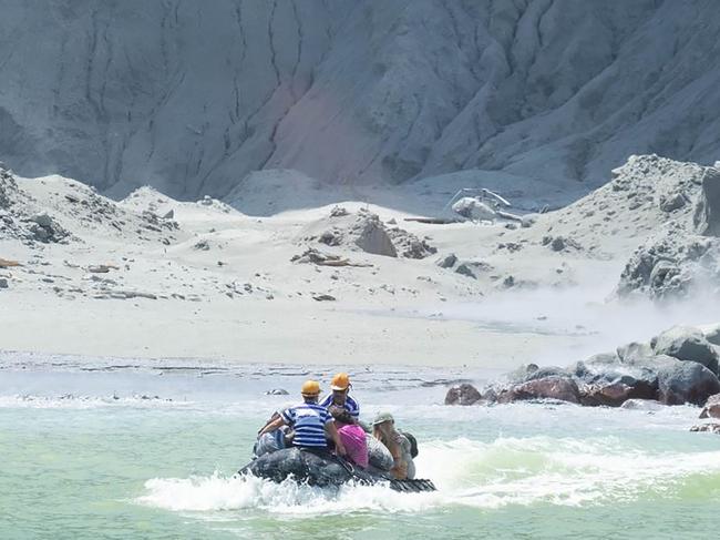 White Island Tour operators rescuing people minutes after the volcano on New Zealand's White Island erupted. Picture: AFP