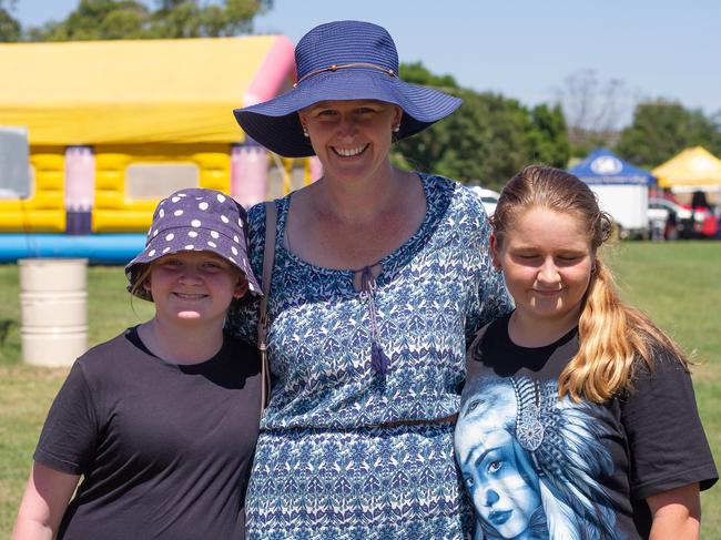 Alison, Jesara and Payton Shute make their way through the sideshow at Murgon Show 2023.