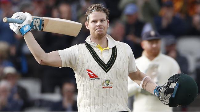 Australia's Steve Smith raises his bat after scoring 200 runs at Old Trafford.