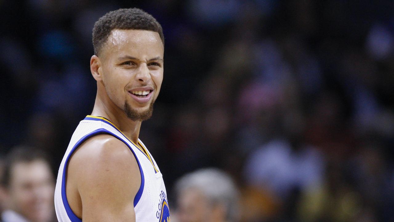 Golden State Warriors guard Stephen Curry reacts to an official's call as his team plays the Charlotte Hornets in the first half of an NBA basketball game Wednesday, Dec. 2, 2015, in Charlotte, N.C. (AP Photo/Nell Redmond)