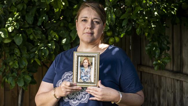 Kathy Bourinaris holds a picture of her mother Fotini Atzarakis, 77, who died after contracting Covid at St Basil’s Aged Care. Picture: Jake Nowakowski