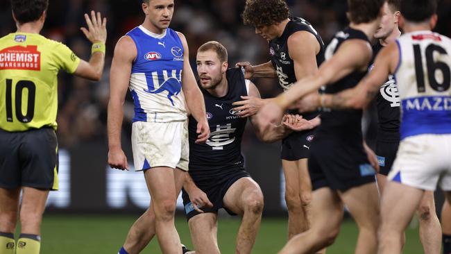 Harry McKay is helped to his feet after the heavy collision. Picture: Darrian Traynor/Getty Images