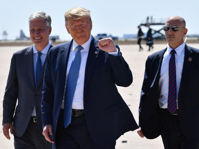 US President Donald Trump, centres, gestures after landing at San Diego International Airport in San Diego, California. Picture: AFP