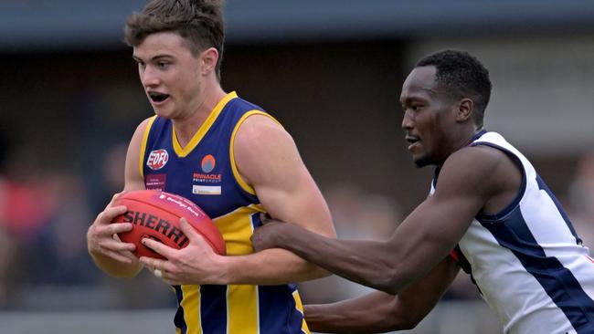 EDFL: Rupertswood’s Fraser Phelan-Smith is closely marked by Bill Sam of St Albans. Picture: Andy Brownbill