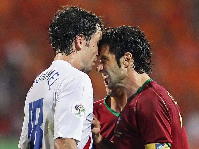 Portugal’s Luis Figo (R) and Dutch midfielder Mark Van Bommel clash during one of the most spiteful clashes in World Cup history.