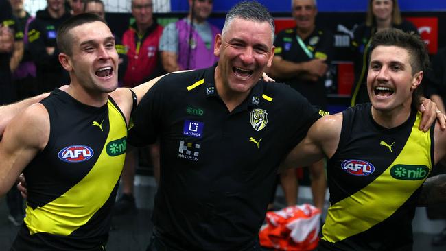 MELBOURNE, AUSTRALIA - MARCH 31:  Jayden Short, Adem Yze and Liam Baker of the Tigers sing the song in the rooms after winning the round three AFL match between Richmond Tigers and Sydney Swans at Melbourne Cricket Ground, on March 31, 2024, in Melbourne, Australia. (Photo by Quinn Rooney/Getty Images)