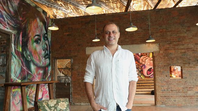 Peter Sourris poses at the old Skate Arena site in Red Hill, Brisbane. (AAP Image/Jono Searle)