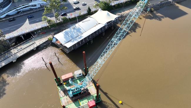 The crane should be able to move the restaurant off the bikeway in less than a week.