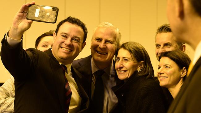 Premier Gladys Berejiklian, Deputy Prime Minister Michael McCormack (centre left), and Transport minister Andrew Constance inside the tunnels late yesterday. Picture: AAP