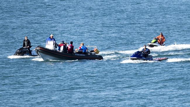 Fanning is pulled from the water after the encounter with the shark. (Picture: WSL/Tostee)