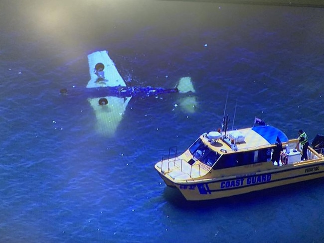 A light plane crashed into the water near Brisbane on Sunday, killing four. Picture: 7 News.