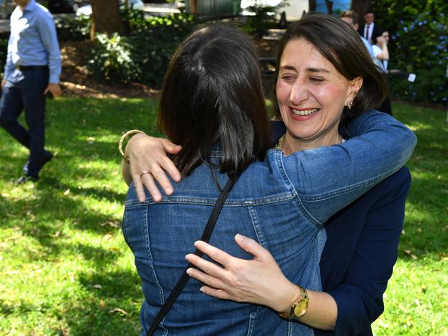 Ms Berejiklian hugs locals after her press conference in Willoughby on Sunday. Picture: AAP