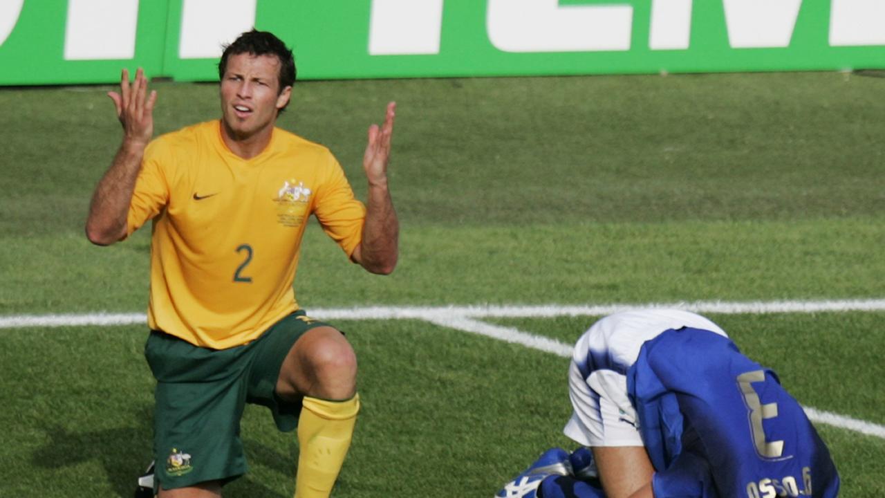 20/12/2006 LIBRARY: Australian soccer player Lucas Neill (2) reacts after he tackled Italian Fabio Grosso in the penalty box during the last minutes of the Australia Socceroos v Italy World Cup soccer match at Fritz Walter Stadium in Kaiserslautern, Germany, 26 Jun 2006. Italy was awarded a penalty and won the match.