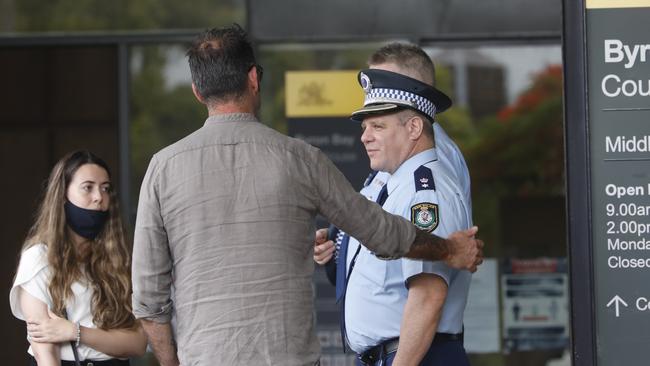 Laurent Hayez speaks with Tweed Byron Police Superintendent Dave Roptell outside court in Byron Bay during the inquest into the 2019 disappearance of Theo Hayez. Picture: Liana Boss