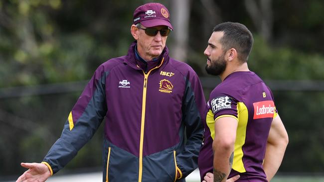 Brisbane Broncos coach Wayne Bennett (left) speaks to player Jack Bird during a team training session ahead of Week 1 of the NRL Finals Series at Clive Berghofer Field in Brisbane, Thursday, September 6, 2018. The Brisbane Broncos face the St George-Illawarra Dragons in an Elimination Final at Suncorp Stadium on Sunday. (AAP Image/Darren England) NO ARCHIVING