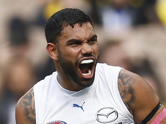 MELBOURNE, AUSTRALIA - AUGUST 19: Tarryn Thomas of the Kangaroos celebrates kicking a goal during the round 23 AFL match between Richmond Tigers and North Melbourne Kangaroos at Melbourne Cricket Ground, on August 19, 2023, in Melbourne, Australia. (Photo by Daniel Pockett/Getty Images)