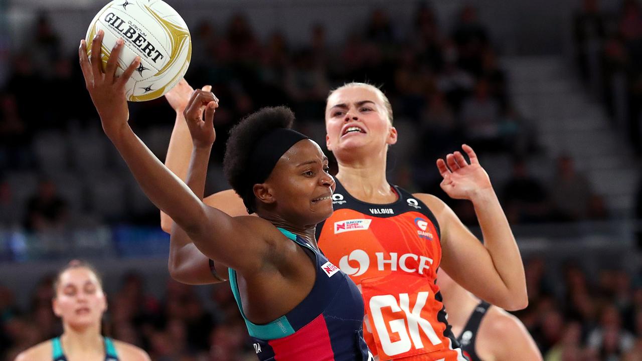 Mwai Kumwenda stretches for the ball against the GWS Giants at John Cain Arena. Picture: Kelly Defina/Getty Images