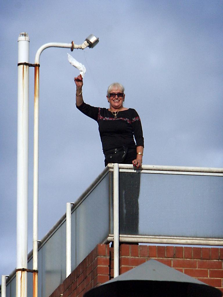Stormy Summers waves from the roof of her Waymouth Street brothel while preventing police from entering and enforcing an eviction order in 2006