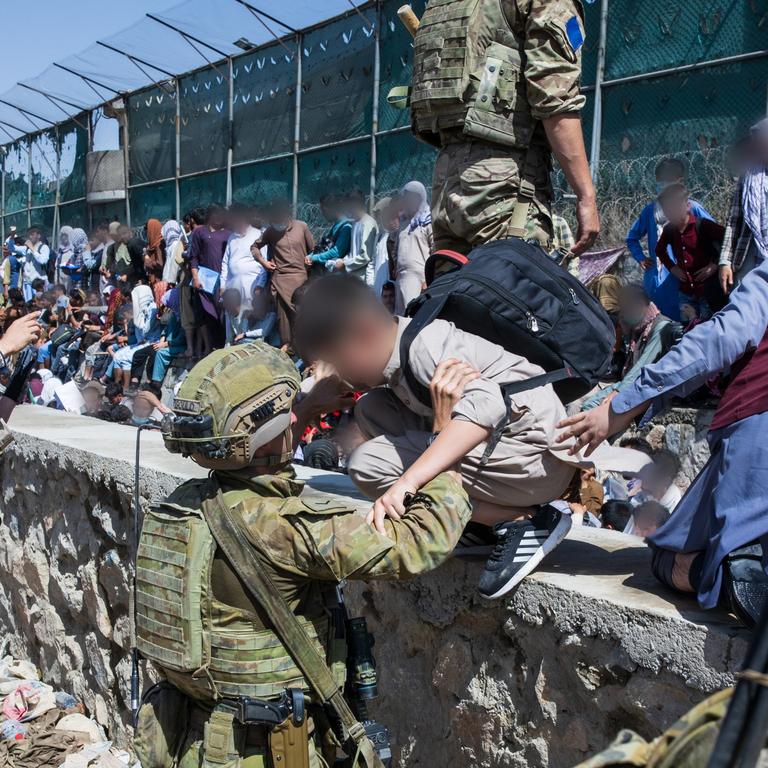 ADF personnel helping to locate Afghan Australian visa holders at the congested Abbey Gate at Hamid Karzai International Airport.