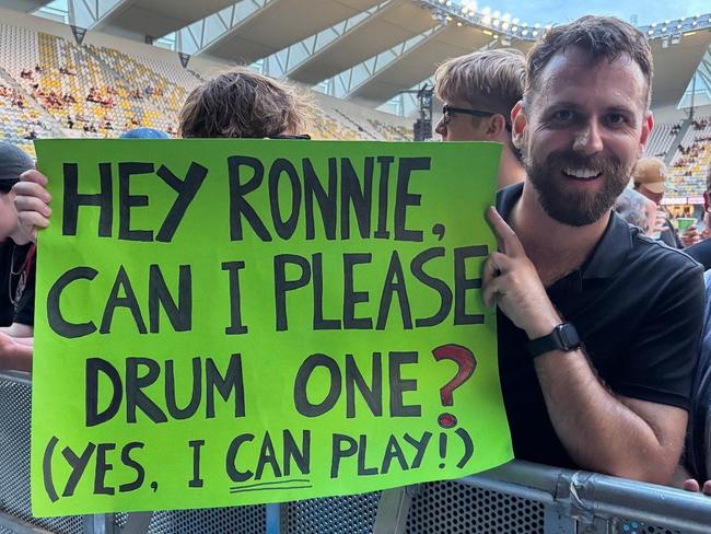 Tim McClelland, a professional percussionist from Mackay, said he took a punt prior to the concert and prepared a sign asking The Killers frontman Brandon Flowers if he could perform ‘For Reasons Unknown’ while versatile drummer Ronnie Vannucci Jr switched to guitar. Picture: Supplied