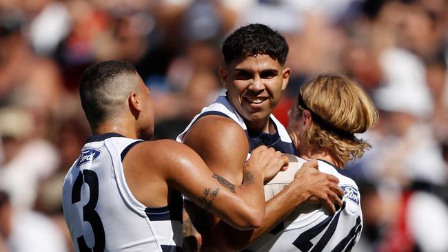 Tyson Stengle celebrates one of his goals on his Cats debut in Round 1 with teammates. Picture: Dylan Burns/AFL Photos via Getty Images