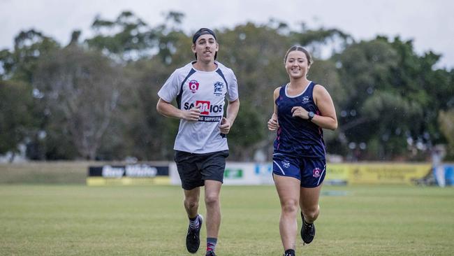 Broadbeach Cats players, Rhys Finn and Sophie Balcombe, are combining to run over 250km in the month of May to raise money for MS. Picture: Jerad Williams