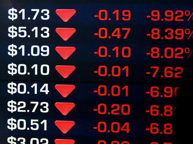 A man is seen in a reflection to stop to look at the electronic share board at the Australian Stock Exchange (ASX) in Sydney, Monday, Aug. 24, 2015. The ASX 200 has dipped below 5100 points for the first time in 18 months, as the big banks continue to bear the brunt of fear selling and with the big miners also getting hit on continued weakness in commodity prices. (AAP Image/Dan Himbrechts) NO ARCHIVING