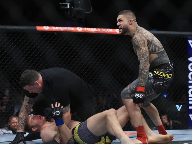 SYDNEY, AUSTRALIA - SEPTEMBER 10: Tyson Pedro of Australia   celebrates his win over Anton Turkalj of Sweden during the UFC 293 event  at Qudos Bank Arena on September 10, 2023 in Sydney, Australia. (Photo by Mark Evans/Getty Images)