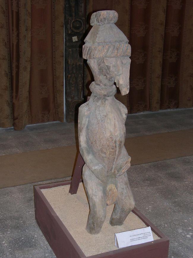 A wooden statue, from which male genitalia had been ripped off by the Taliban.