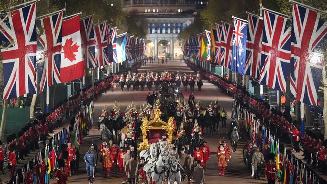 More than 7000 personnel took part in a dress rehearsal for the procession march, giving night owls a glimpse of the pomp and pageantry that awaits. Picture: PA Images via Getty Images