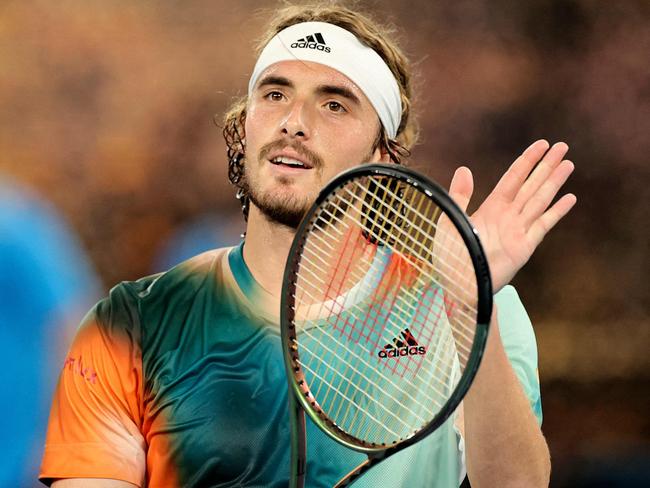 Greece's Stefanos Tsitsipas celebrates winning the men's singles quarter-final match against Italy's Jannik Sinner on day ten of the Australian Open tennis tournament in Melbourne on January 26, 2022. (Photo by Martin KEEP / AFP) / -- IMAGE RESTRICTED TO EDITORIAL USE - STRICTLY NO COMMERCIAL USE --