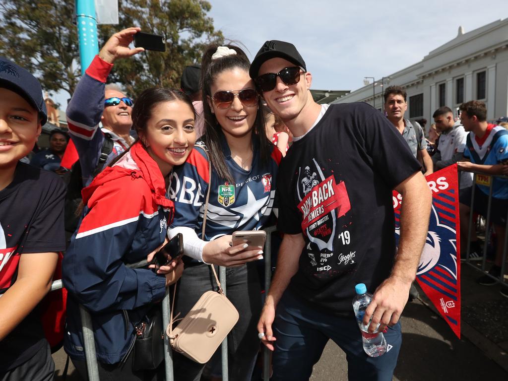 Caroline Manookian , Rebecca Warian and Sam Verrills pictured at the Sydney Roosters fan morning at Moore Park after the Roosters win in the 2019 NRL Grand Final. Picture: Richard Dobson