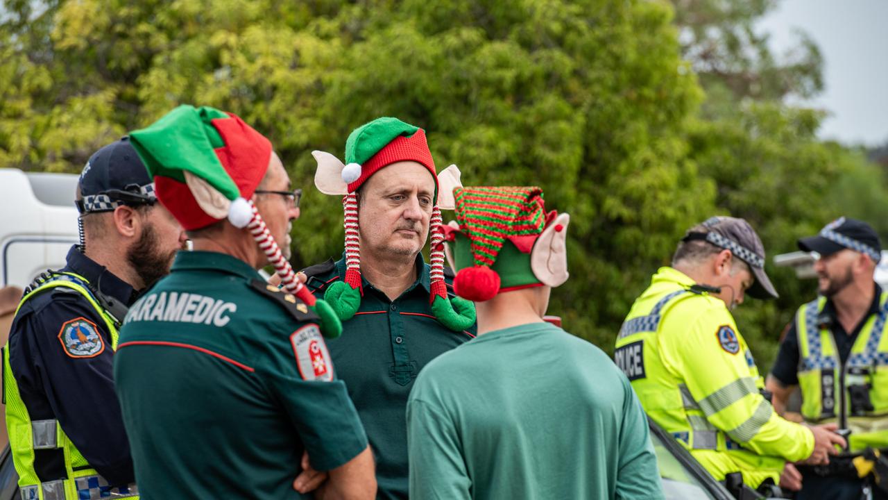 Paramedics wait as Santa prepares to visit Casuarina Square. Picture: Pema Tamang Pakhrin