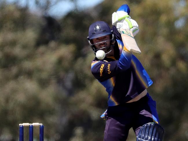 Ian Holland sends the ball to the fence. Picture: Mark Dadswell/AAP