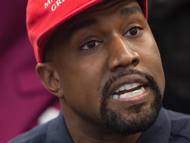 (FILES) In this file photo taken on October 11, 2018, Kanye West meets with US President Donald Trump in the Oval Office of the White House in Washington, DC. - Kanye West declared his "love" of Nazis and admiration for Adolf Hitler on Thursday, sparking outrage as another commercial partner announced it was splitting from the troubled superstar. In an extraordinary hours-long appearance on Infowars, the show fronted by conspiracy theorist Alex Jones, West -- now known as Ye -- wore a black mask completely covering his face, as he ranted about sin, pornography and the devil. (Photo by SAUL LOEB / AFP)