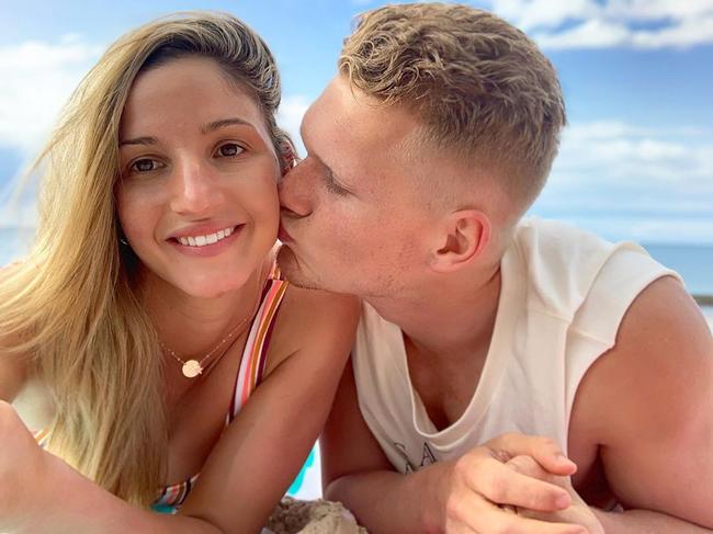 Adam Treloar and his wife.