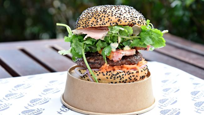 The epic “Bun Mi” burger with Julianne’s Kitchen’s chicken pate along with Burger Hounds’ signature burger patty plus pork belly, pickled carrots, Spanish onions, wasabi mayo, coriander and shallots.