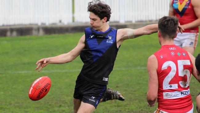 Henry Bennett gets a kick away for University Blacks in the VAFA. Picture: Facebook