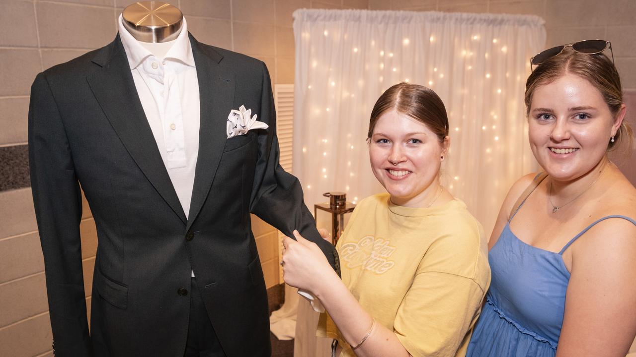 Bride-to-be Kelsey Forrester (left) with bridesmaid Kaitlyn Hanson admire a suit by Merlai Italian Tailors on show at Toowoomba's Wedding Expo hosted by Highfields Cultural Centre, Sunday, January 21, 2024. Picture: Kevin Farmer