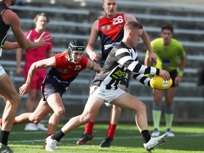 Glenorchy’s Nathan Blowfield avoids the tackle of North Hobart’s Angus Norton. Picture: Nikki Davis-Jones