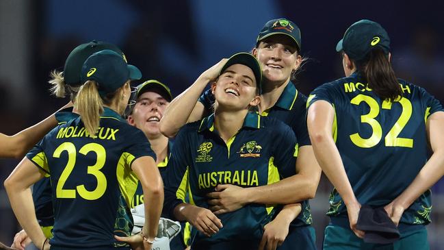 SHARJAH, UNITED ARAB EMIRATES - OCTOBER 13: Phoebe Litchfield of Australia celebrates with team mates after running out Rch during the ICC Women's T20 World Cup 2024 match between India and Australia at Sharjah Cricket Stadium on October 13, 2024 in Sharjah, United Arab Emirates.  (Photo by Francois Nel/Getty Images)