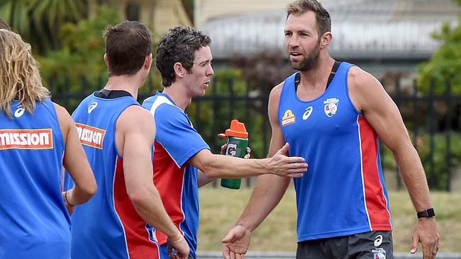 Travis Cloke gets to know his new teammates, including Bob Murphy. Picture: Nicole Garmston