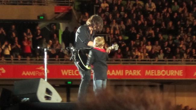 Zander Chugg meets Dave Grohl. Foo Fighters, AAMI Park, 2011. Picture: File