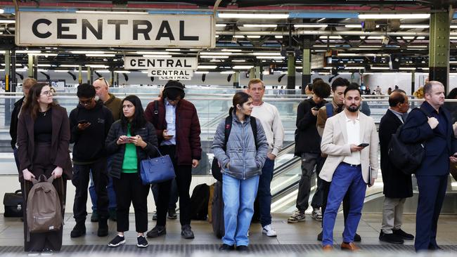 Commuters wait for a train at Central Station on Wednesday night. Picture: Jonathan Ng