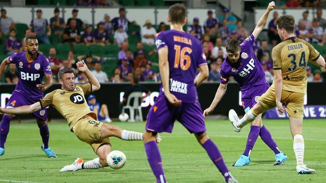 Alex Grant, second from right, scores for Perth Glory against Western Sydney at HBF Park. Picture: AAP