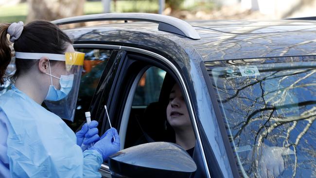 Staff administer COVID-19 tests at a drive-through testing clinic in Balmain in Sydney, after a Woolworths staff tested positive. Picture: Nikki Short